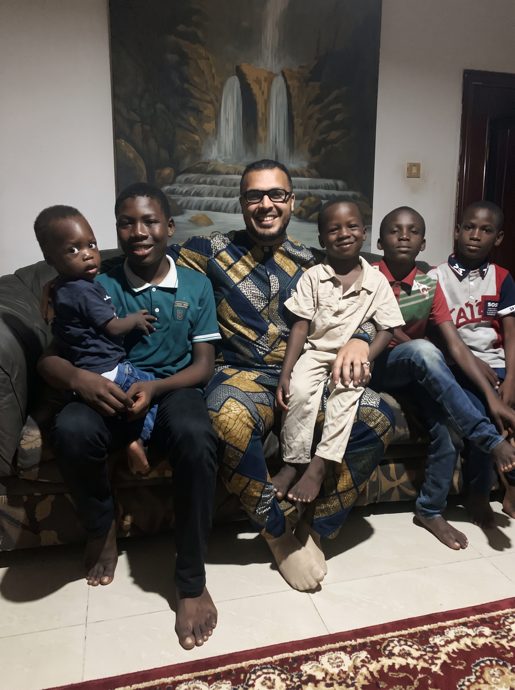 Zoaib Ali with children during a community visit in Africa