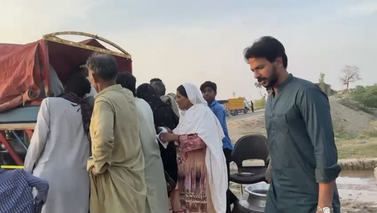 A team member helping with a community food distribution