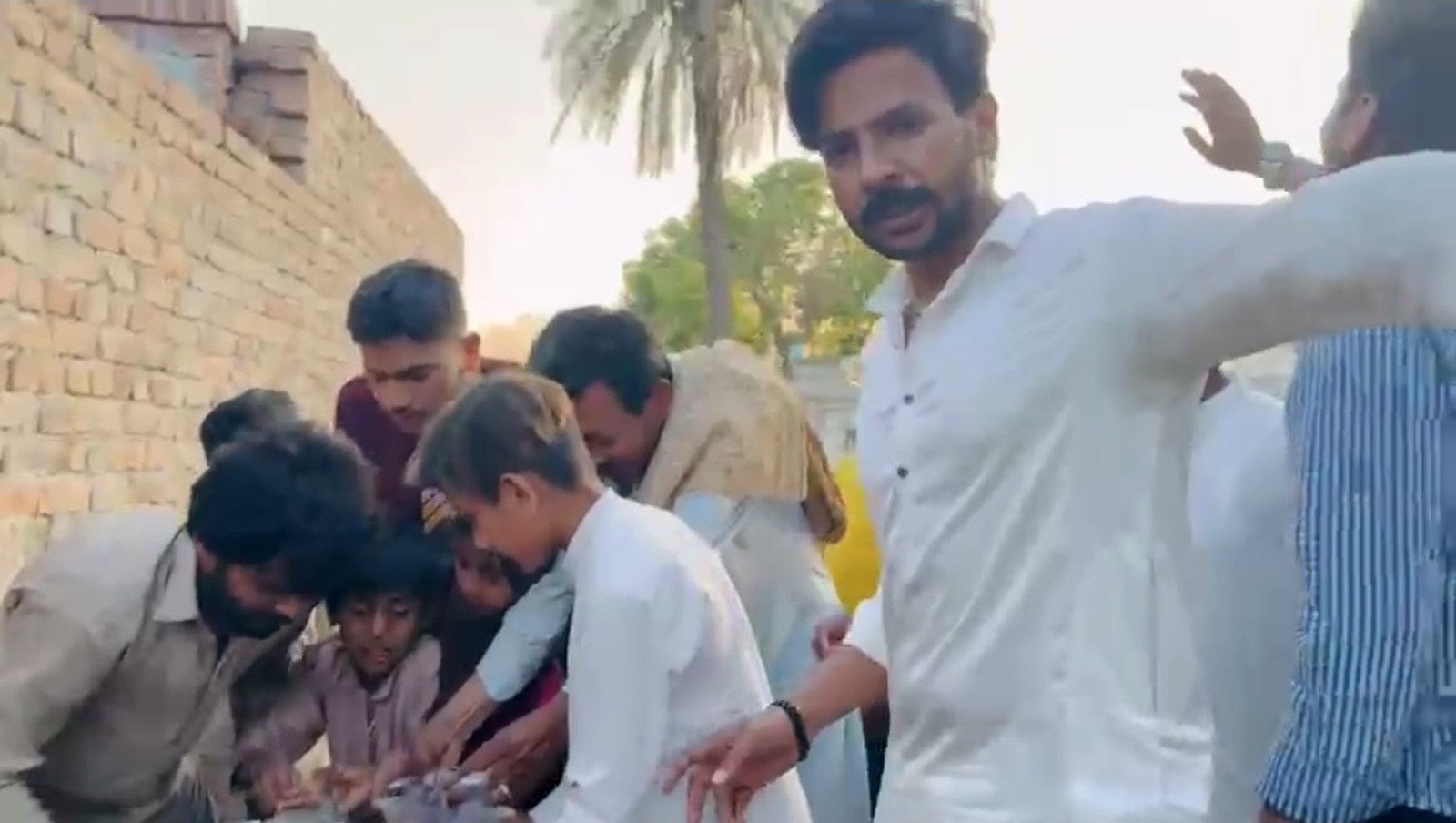 Volunteers helping children during a community food distribution